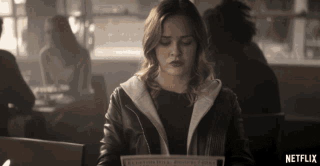 A girl choosing food from a menu, representing how to select the right life insurance plan.
